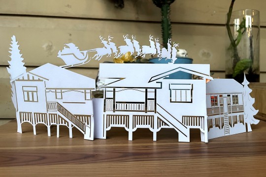 Image of a paper cut diorama of Queenslander houses