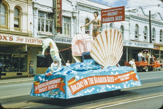 Colourful float advertising Queensland as a key travel destination, 1956