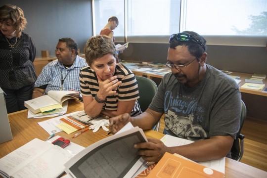 Researchers exploring the State Library collections