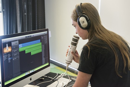 Young person using the the Digital Media Lab at The Edge