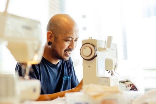 Sewing machine being used