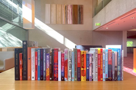 A big row of books on a table in the Poinciana Lounge