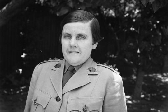 Head and shoulders of woman in defence uniform 1944