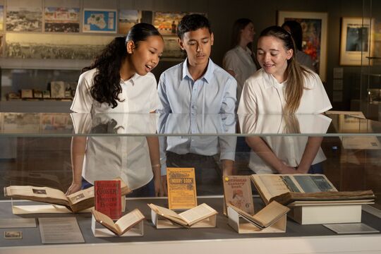 Student looking at collections in Philip Bacon Heritage Gallery