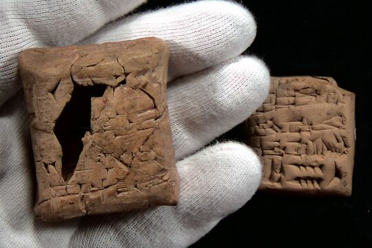 Ancient Sumerian tablet and envelope