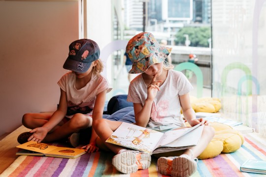 Kids reading at The Corner