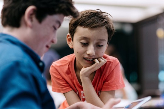 Children using iPad at the State Library of Queensland's Summer Festival event. Photo by Josef Ruckli.
