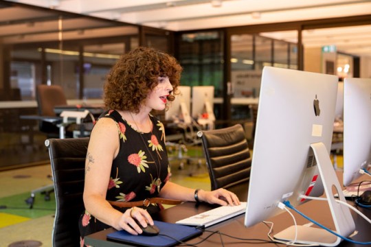 Woman using a computer at the State Library