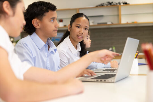 Students in classroom watching Live at the Library