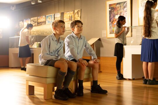 Student looking at collections in Philip Bacon Heritage Gallery