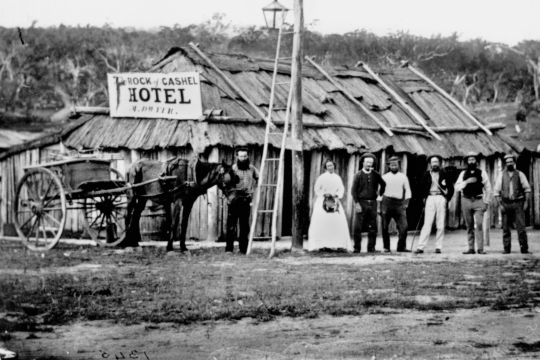Bridal party in front of Martin Dwyer's Rock of Cashel Hotel at the Thirteen Mile Creek, Sugarloaf, 1873. State Library of Queensland. Neg 94202.