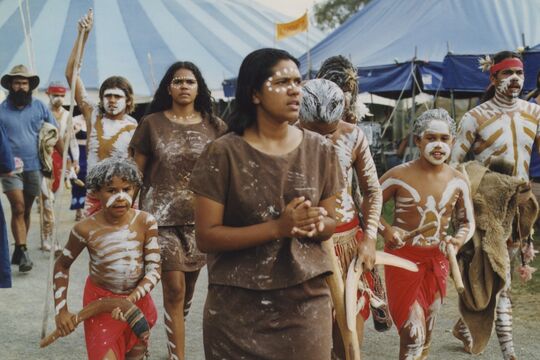 a group of young aboriginal people in traditional paint 