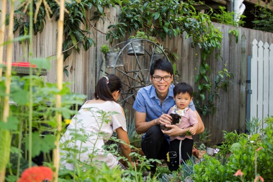 Mother, father and child in garden