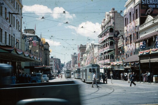 View along Adelaide Street from George Street with the buildings decorated for the Royal Visit, 1954