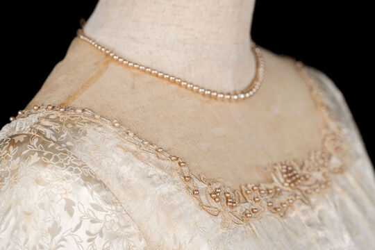 Neckline detial on wedding dress.