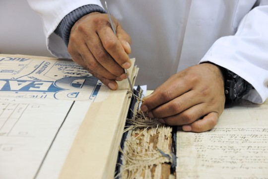 State Library of Queensland staff member preserving Blocksidge collection