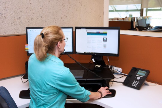 State Library of Queensland staff member on the phone