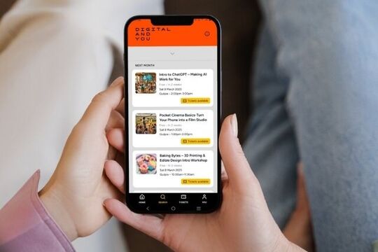 Hand holding Digital and You app