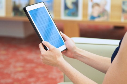 A person reading an eBook at the library