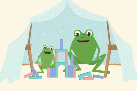 Two frogs reading books inside a cubby house