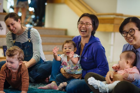 Parents and babies clapping and laughing