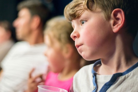Kids watching a film