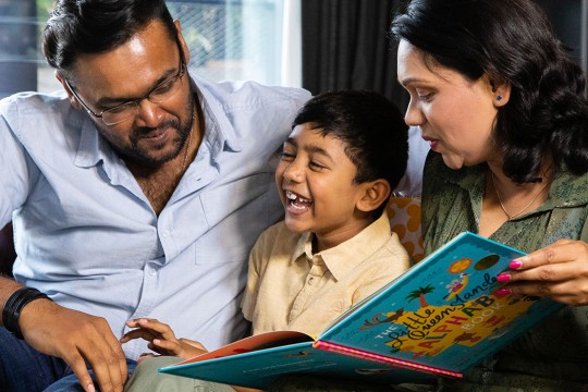 Family reading to child