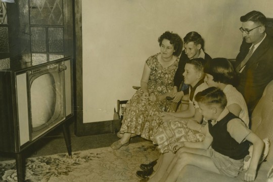 A typical family watching tv in 1959