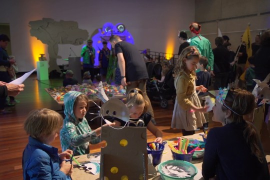 Families enjoying the Great and Grand Rumpus interactive cardboard installation
