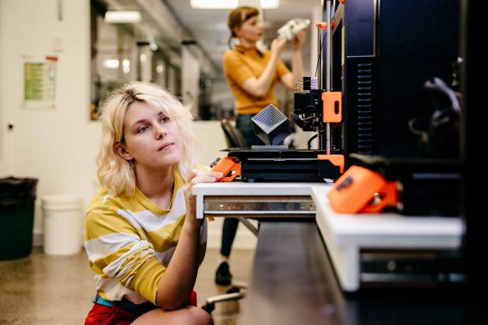 Woman using a 3D printer at The Edge