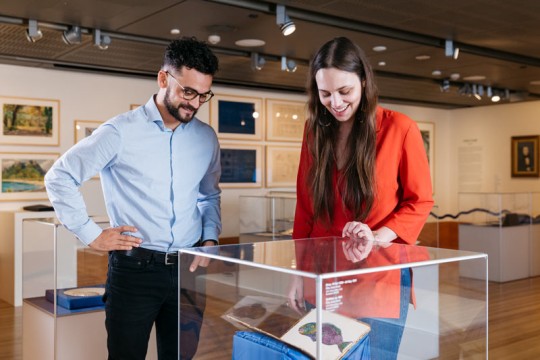 People looking at Islands exhibition