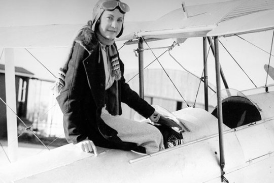Ivy May Hassard sitting in the cockpit of an air craft ca1935
