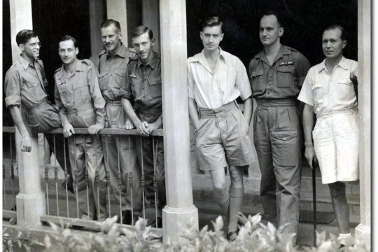 Alan Douglas Groom and other cadets standing on a veranda, 1935