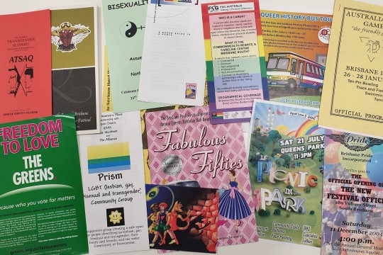 Photo of various ephemera items including brochures pamphlets and programs