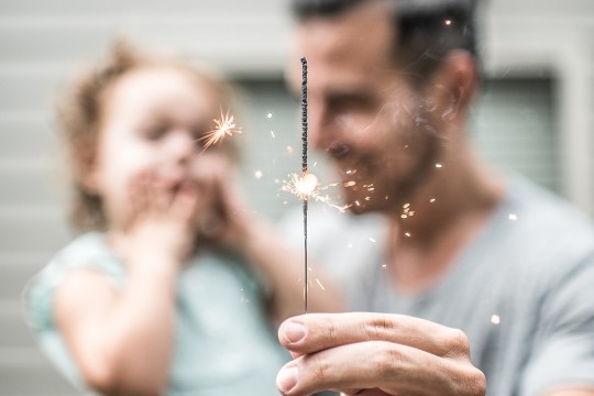 Father and toddler with sparkler