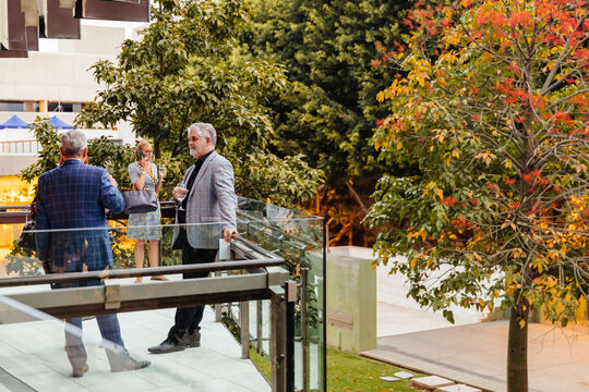 People at an event on Queensland Terrace.