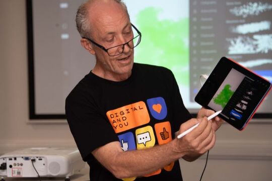 Person teaching a digital art class