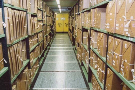 Rows of shelving in a repository at The National Archives in Kew