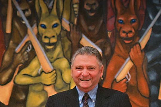 James C Sourris in front of kangaroo artwork