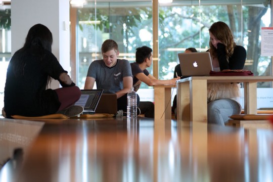 Students using laptops to study at the State Library