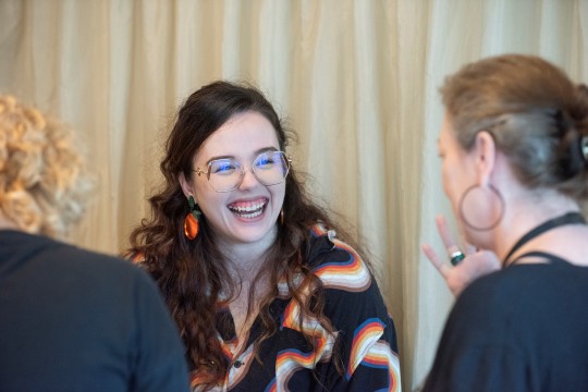 Sasha Vucicevic smiling and laughing at the Young Writers Award 2022 Morning Tea