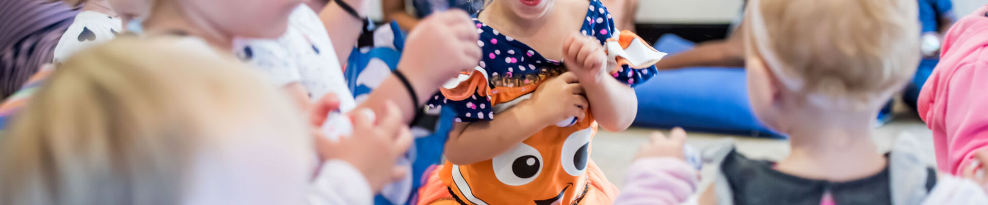 Children wearing costumes and dancing