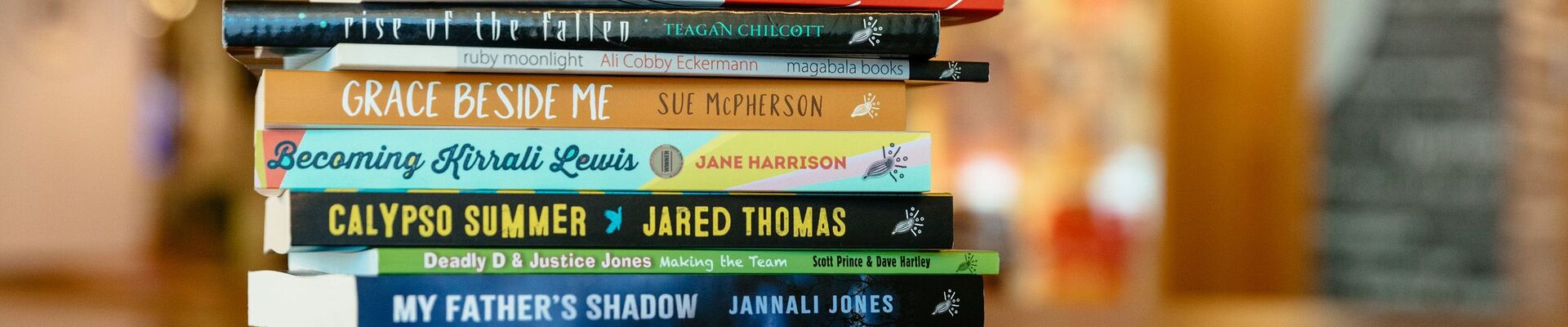 A stack of books by blackwrite authors taken in State Library