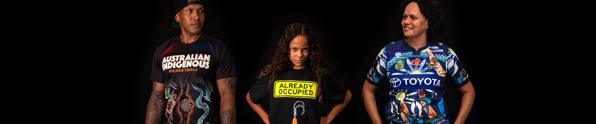People wearing Indigenous shirts