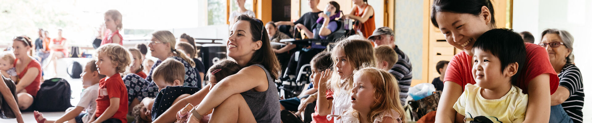 Parents and children enjoying a storytime performance