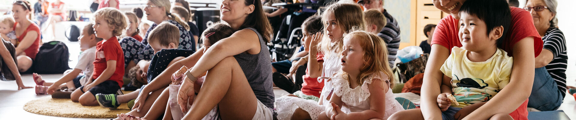 Parents and children as enjoying storytelling performance