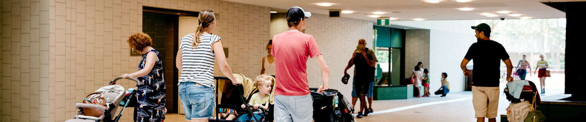Visitors pushing prams through the Knowledge Walk at State Library