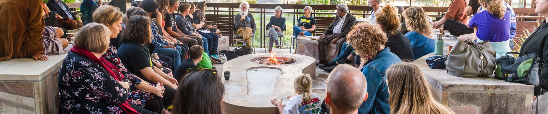 A Night By The Fire with Bruce Pascoe, Dr Glenda Nalder and Libby Harward Group of people sitting around the fire talking