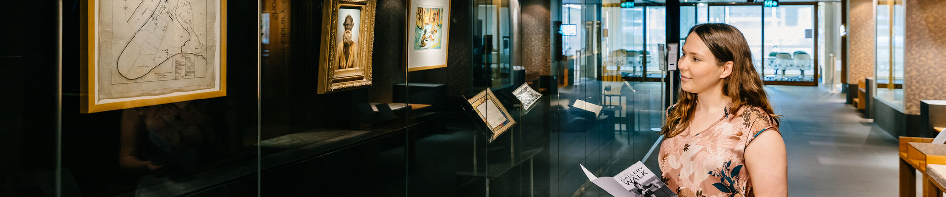 Visitor viewing the Talbot Family Treasures Wall