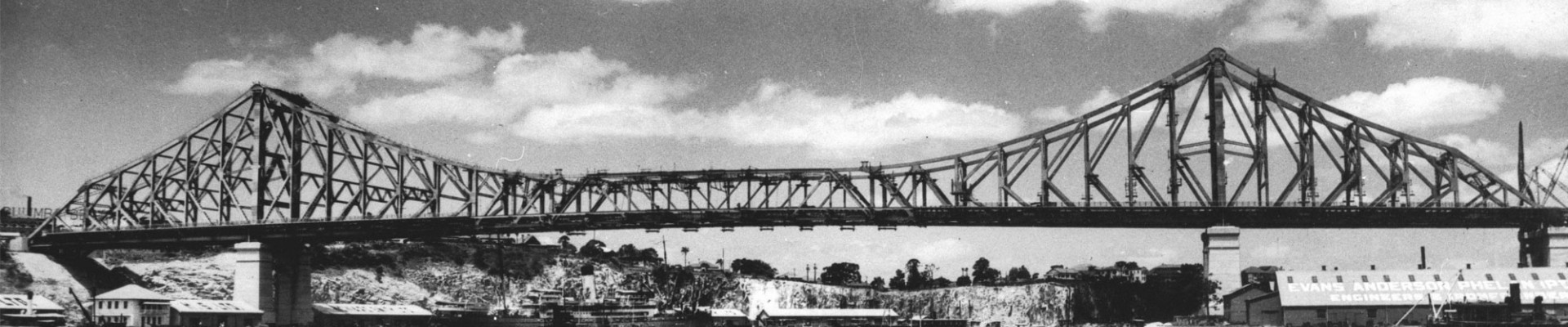 Brisbanes Story Bridge 1940 The 281 metre cantilever bridge was built between19351940 constructed by Evans Deakin - Hornibrook Pty Ltd The premises of Evans Anderson Phelan Pty Ltd Engineers at Kangaroo Point are visible on the right The New Farm cliffs can be seen in the background The bridge connected Fortitude Valley and the southside suburbs It is heritage listed and now carries 30 million cars per year 16 bridges cross the river but the Story Bridge remains the grandfather of them all